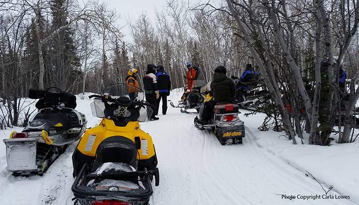 Riders gather to enjoy the view of Cowley Lake on the K.S.A.'s Annual Take a Friend Snowmobiling Ride - February 2017