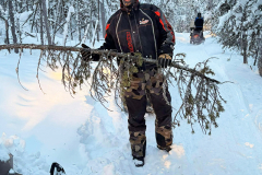 Klondike Snowmobile Association volunteers clearing fallen trees from the Trans Canada Trail in the Whitehorse area - January 2026