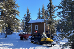 Klondike Snowmobile Association volunteers arriving at the half-way cabin on the Dawson Overland Trail to make some repairs - February 2025