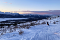 Klondike Snowmobile Association members enjoying a ride on Mt. McIntyre at sunset - January 2026