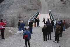 Deb Greenlaw cutting the ribbon at the Grand Opening of the Peter Greenlaw Memorial Bridge over Wolf Creek on the Copper Haul Trail  -  October 2011